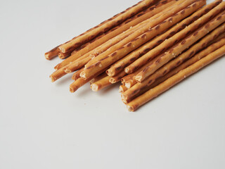 Salty crackers on a white background, cookie snacks. Selective focus.