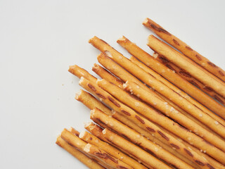 Salty crackers on a white background, cookie snacks. Selective focus.