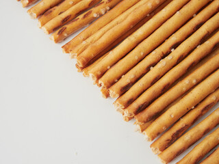 Salty crackers on a white background, cookie snacks. Selective focus.