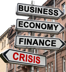 The road indicator on the arrows of which is written - business, economics, finance and CRISIS