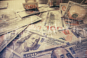 Fototapeta premium Multi exposure of forex chart drawing over us dollars bill background. Concept of financial success markets.
