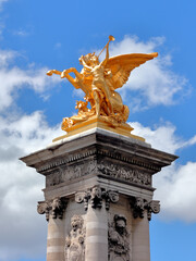 Gilded Fames sculptures on the socle counterweights on the Alexander III bridge (Pont Alexandre...
