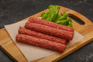 Raw beef sausages with spices