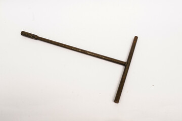 old wrench T on a white background