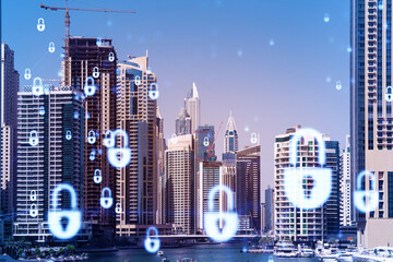 Skyscrapers of Dubai business downtown. International hub of trading and financial services. Lock icon hologram, concept of datum security. Double exposure. Dubai Canal waterfront.