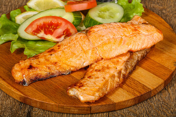 Grilled salmon served vegetables and lemon