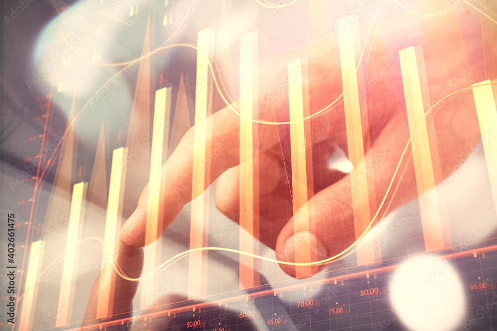 Poster multi exposure of man's hands holding and using a phone and financial chart drawing. market analysis