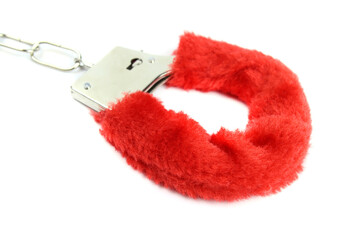 fluffy pink handcuffs isolated on white background