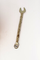 old rusty wrench on white