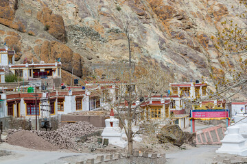Tibetan traditional stupas and village at the Hemis monastery with background of barren mountains...