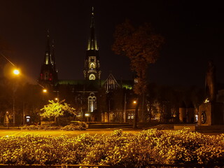 Olha and Elizabeth Church in Lviv at night. Neo Gothic style cathedral in night Lviv city. Stepan Bendery monument near the cathedral