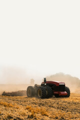 Naklejka premium Autonomous tractor working on the field. Smart farming 