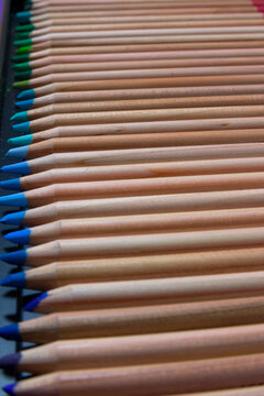 Set of colored pencils in a box. Set of artist’s pencils. Wooden color pencils. The artist’s drawing tool. Multi-colored pencils. Pencil point.