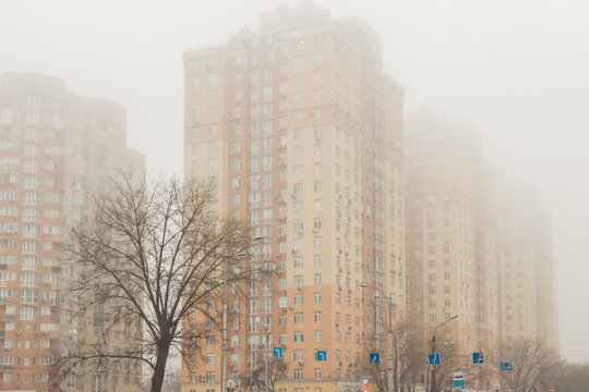 High-rise residential buildings in the fog. City in fog. Kyiv