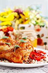 Indian cuisine: roasted chicken with rice and vegetables.