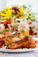 Indian cuisine: roasted chicken with rice and vegetables.