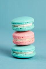 Colorful sweet macarons on a blue background