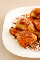 Indian cuisine: roasted chicken with rice and vegetables.