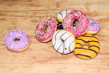 multicolored donuts yellow pink chocolate
