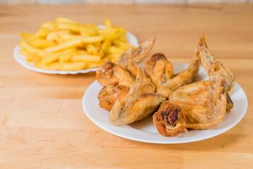 fried chicken wings with french fries