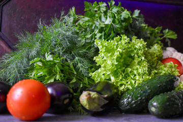 Various vegetables and herbs on the table