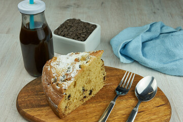 Cake with coffee on wooden table