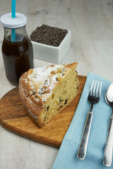 Cake with coffee on wooden table