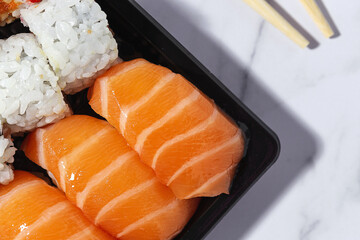 Japanese food concept to go. Sushi take away assortment