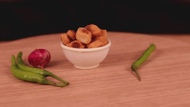 Bhakharwadi Namkeen,Famous Indian tea time snacks,pepper sev,mota sev,south indian snacks,Namkeen or Assorted Salty Snack on wooden spoon in white bowl,Namkeen, Farsan,