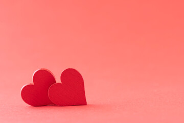 Hearts of fabric on a red background. Time for lovers' day, Valentine's day.