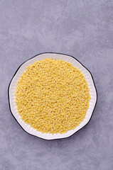 Fine dry pasta in a ceramic dish
