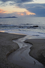 river landscape rushing into the sea at sunset