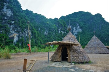 Tipi, Residence of indigenous people and karst mountains in Trang An, Tam Coc, Vietnam -...