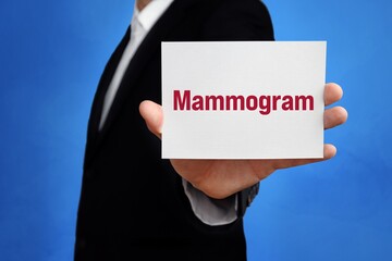 Mammogram. Lawyer (man) holding a card in his hand. Text on the sign presents term. Blue background.