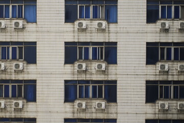 An old building covered with air conditioners in China