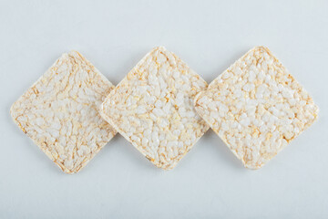 Delicious airy crispbread on white background