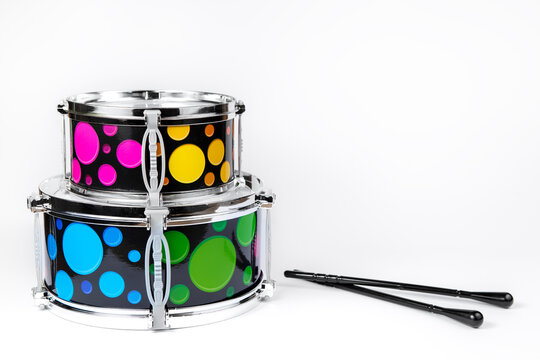 Colorful metal and plastic toydrum in bright colors for kids isolated on white background.