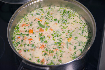 Ciorba Radauteana , a typical sour chicken soup with garlic, vegetables and cream, originally from the city of Radauti, in the historical region of Bukovina, Romania 