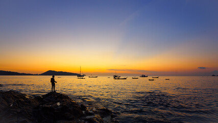 Scene of sunset at Kalim beach, Phuket, Thailand