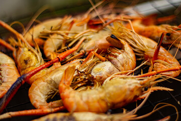 The grilled shrimp on the stove are about to be ready to eat.