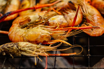 The grilled shrimp on the stove are about to be ready to eat.