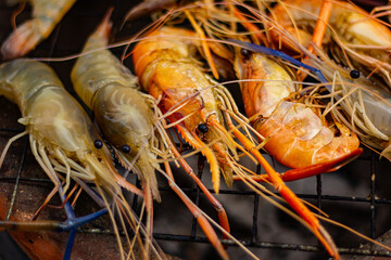 The grilled shrimp on the stove are about to be ready to eat.