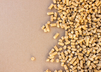 wooden pellets background, pattern. Wood pellets on a blank brown background, free copy space. flat lay