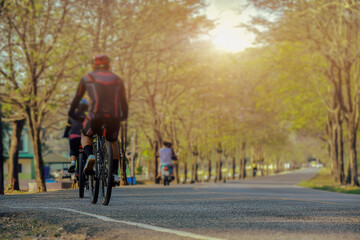 Cycling competition, cyclist athletes riding a race at high speed alective focus and blurred...