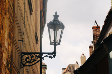 Fototapeta na wymiar street lamp detail of Prague with sky in the background