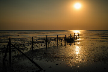 Obraz premium Sonnenuntergang über dem Watt
