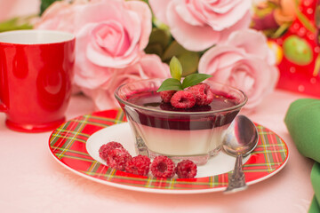 Italian dessert panna cotta with berry sauce, fresh berries.