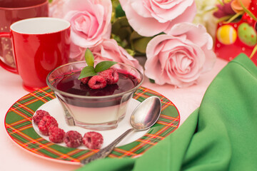 Italian dessert panna cotta with berry sauce, fresh berries.