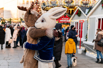 Kyiv (Kiev), Ukraine - December 27, 2020: Two animators (mascots) dressed as animals are hugging...