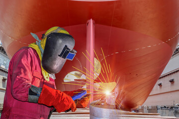 Workers Welding arc with spark light factory at shipbuilding and ship Repairing industrials, wear...